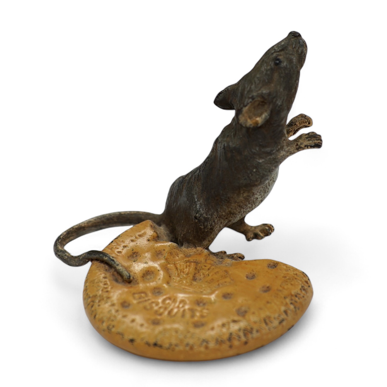 Franz Bergmann (1861-1936), a cold painted bronze study of a mouse and a biscuit, stamped marks to base, 5cm tall. Condition - fair